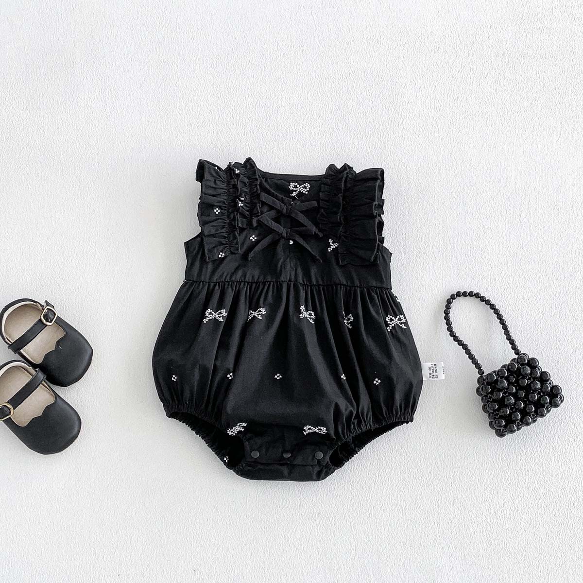 رومبير أسود مطبوع عليه فيونكة  - مراجعة Baby Clothing Online وسعره